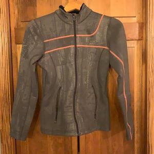 Under Armour fleeced lined women’s jacket.  Gray and pink.  Small